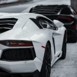 cars, super cars, luxury cars, lamborghini, corvette, black car, white car, sports cars, exotic cars, daytime, parked cars, car row, black lamborghini, white lamborghini, black corvette, high-end vehicles, automobile, car collection, outdoor